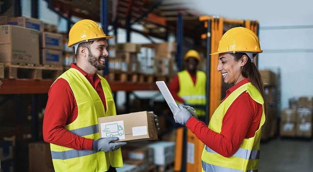 warehouse workers using tablet application for logistics