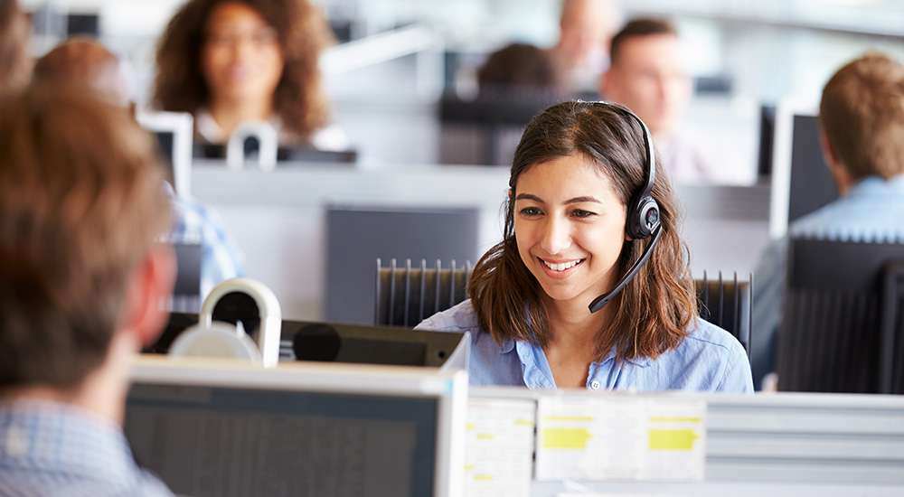call center worker on the phone in an office