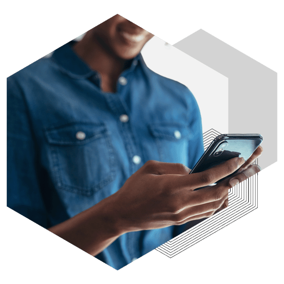 close up of woman smiling and using a smart phone