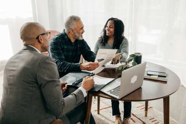 clutch referral_couple sitting with financial advisor-600px