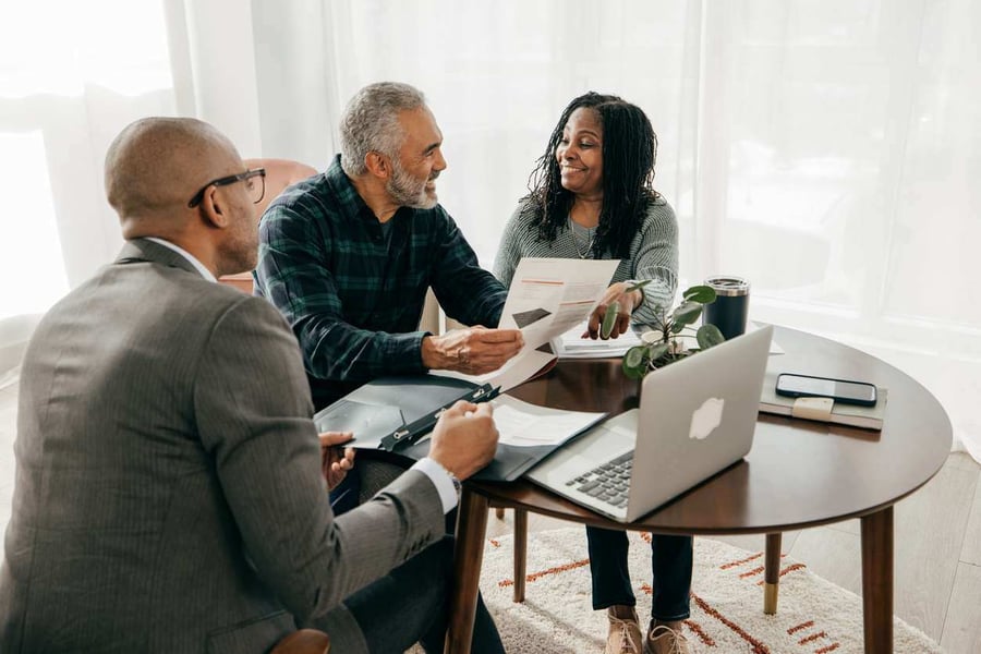 couple sitting with financial advisor